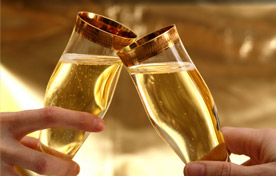 Photo of champagne glasses toasting
